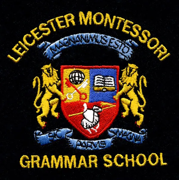 Detailed embroidered school crest badge with lions, a shield and a motto.